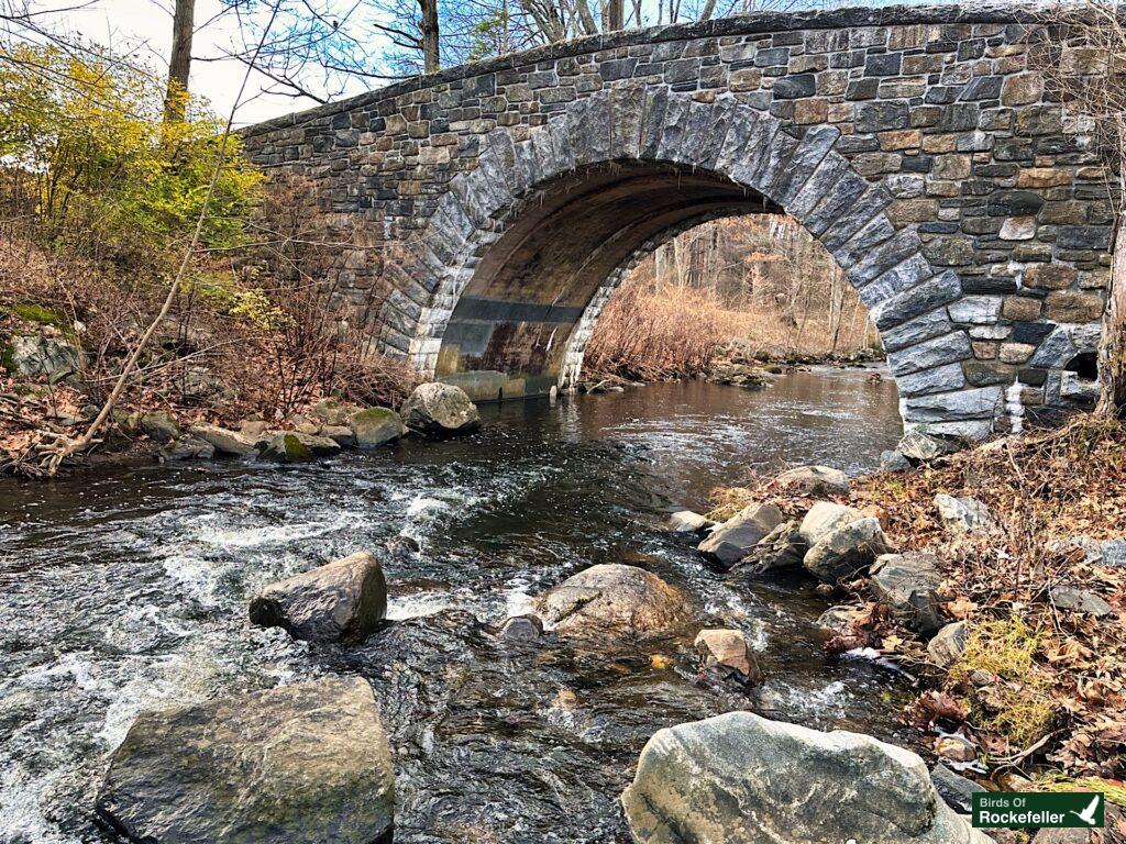 A stone bridge in Rockefeller State Park Preserve over the Pocantico River.